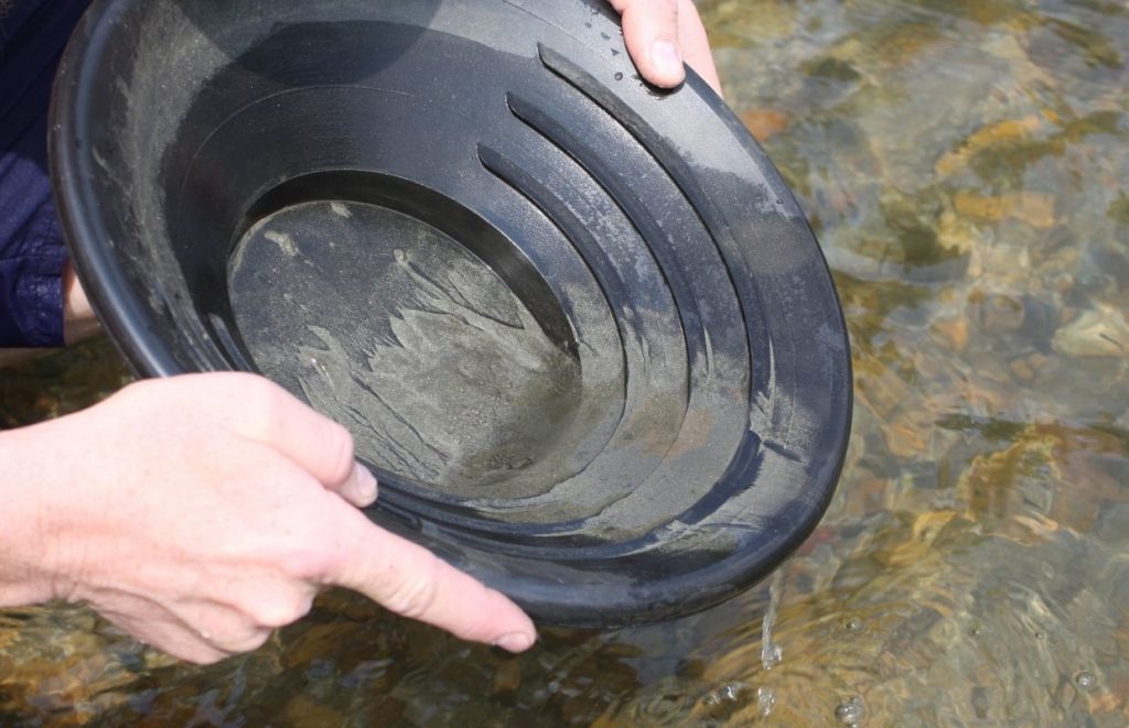 A person panning, trying to find gold in Missouri