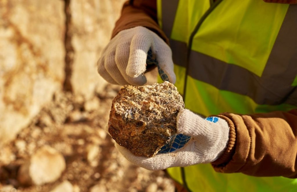 What Is Rock Hunting? - A man holding a rock that he has found