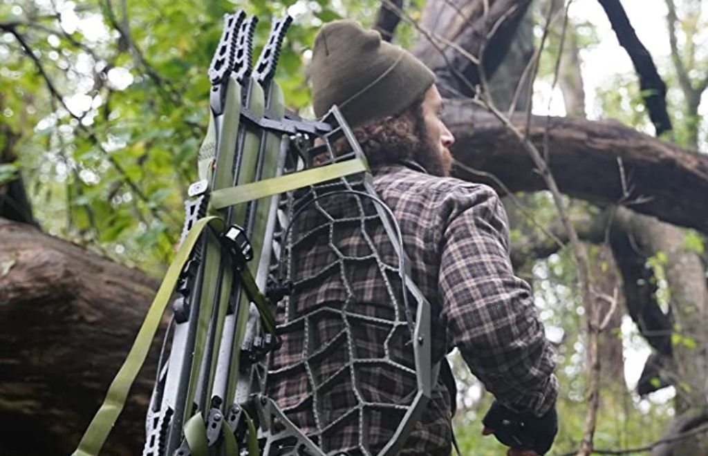 A man carries the hang-on treestand in his back