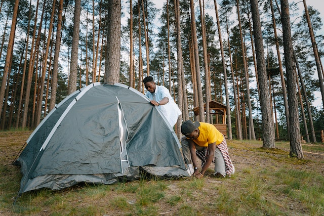 preparing waterproof tent before the rain